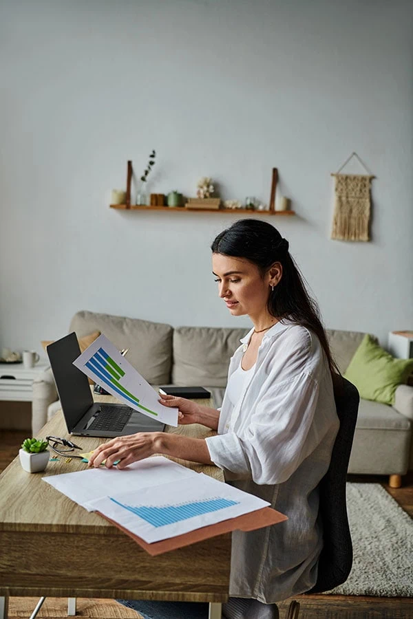 young-woman-researching-on-laptop-conventional-mortgage-loan